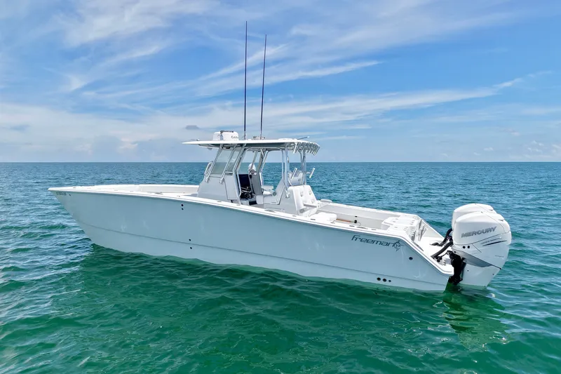 Slide: The Image of 2018 Freeman 34VH boat on open sea with clear skies. - 32