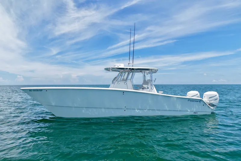 Slide: The Image of 2018 Freeman 34VH boat on open sea under blue sky. - 1