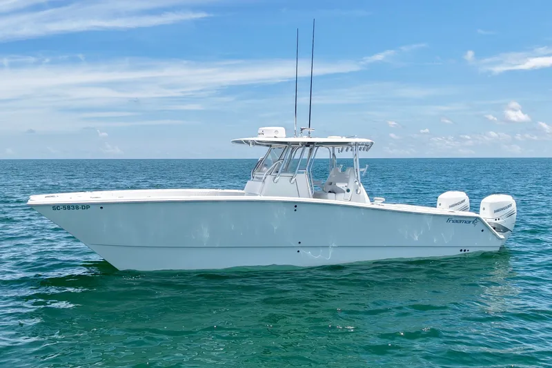 Slide: The Image of 2018 Freeman 34VH boat on open sea under clear blue sky. - 27
