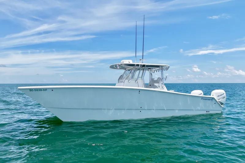 Slide: The Image of 2018 Freeman 34VH boat on calm ocean under clear blue sky. - 26
