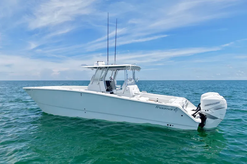 Slide: The Image of 2018 Freeman 34VH boat on open sea under clear blue sky. - 33