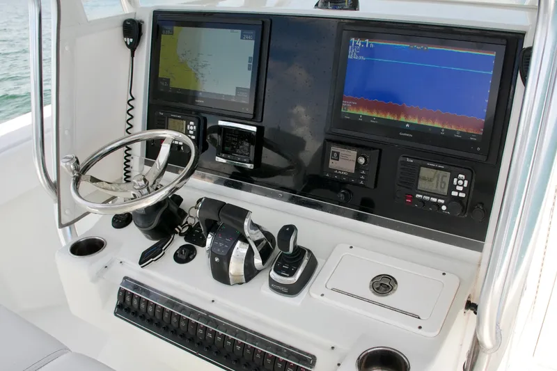 Slide: The Image of 2018 Freeman 34VH boat dashboard with navigation screens and controls. - 50
