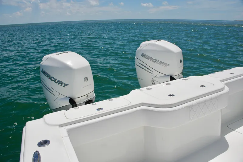 Slide: The Image of Freeman 34VH 2018 boat with dual Mercury outboard engines on open water. - 62