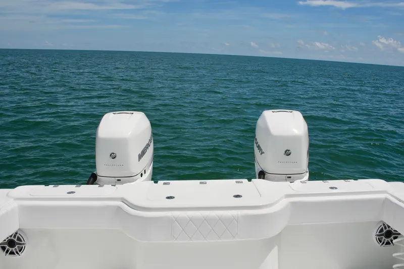 Slide: The Image of Freeman 34VH 2018 boat with dual Mercury outboard engines on open sea. - 63