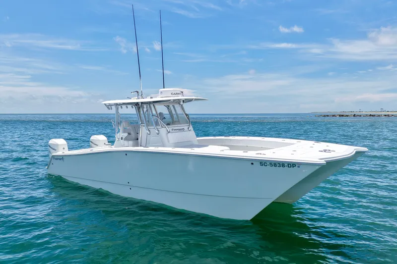 Slide: The Image of 2018 Freeman 34VH boat on calm ocean waters under a clear blue sky. - 19
