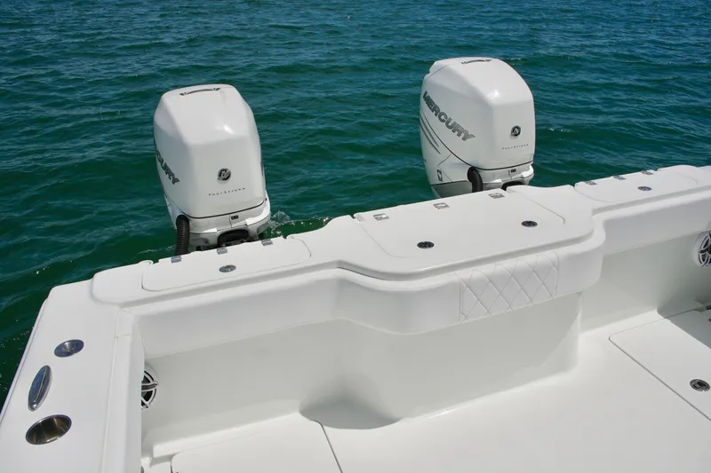 Slide: The Image of Freeman 34VH 2018 boat with dual Mercury outboard engines on open water. - 60