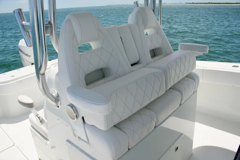 Slide: The Image of Luxurious white seating on a 2018 Freeman 34VH boat, overlooking the ocean. - 46