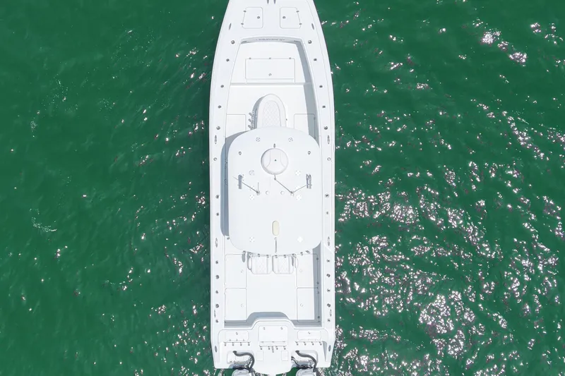 Slide: The Image of Aerial view of 2018 Freeman 34VH boat on sparkling green water. - 29