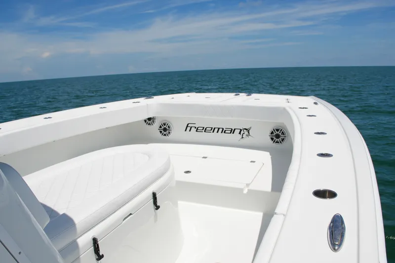Slide: The Image of Freeman 34VH 2018 boat on open sea, showcasing sleek design and spacious deck. - 38