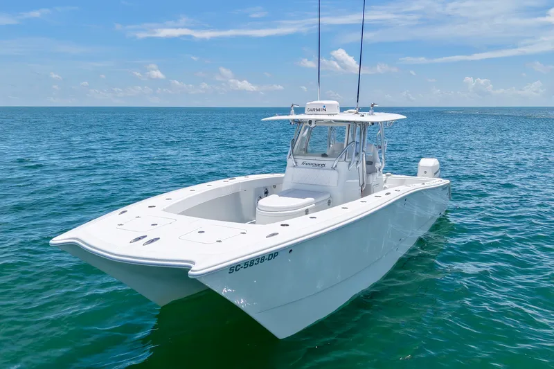 Slide: The Image of 2018 Freeman 34VH boat on open ocean under clear blue sky. - 24