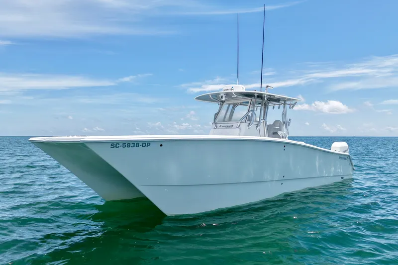 Slide: The Image of A 2018 Freeman 34VH boat on open water under a clear blue sky. - 25