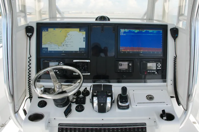 Slide: The Image of Freeman 34VH 2018 boat dashboard with navigation screens and controls. - 53