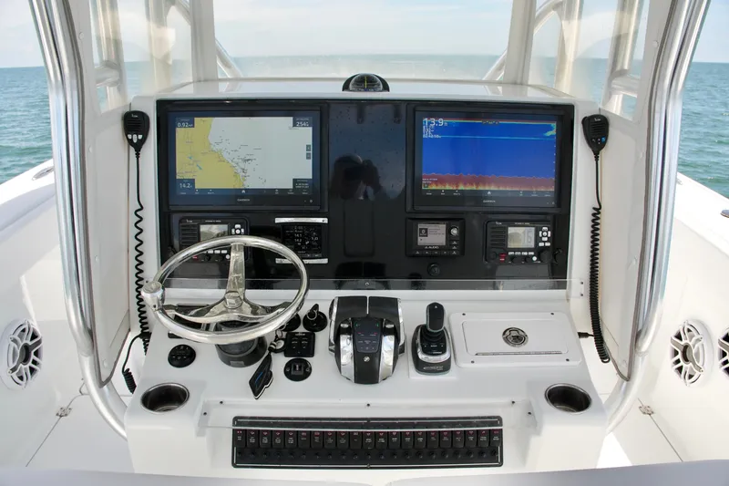 Slide: The Image of Freeman 34VH 2018 boat dashboard with navigation screens and controls. - 52