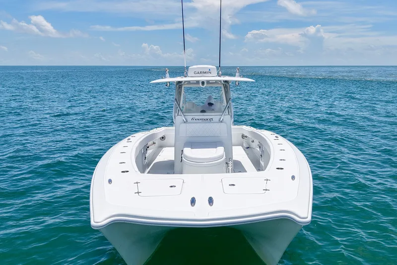 Slide: The Image of 2018 Freeman 34VH boat on open ocean, clear skies, and calm waters. - 23