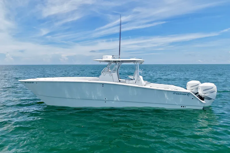 Slide: The Image of 2018 Freeman 34VH boat on open sea under clear blue sky. - 28