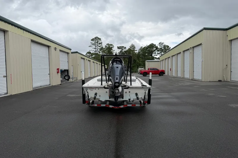 Slide: The Image of 2020 Hewes Redfisher 18 boat on trailer in storage facility parking lot. - 15