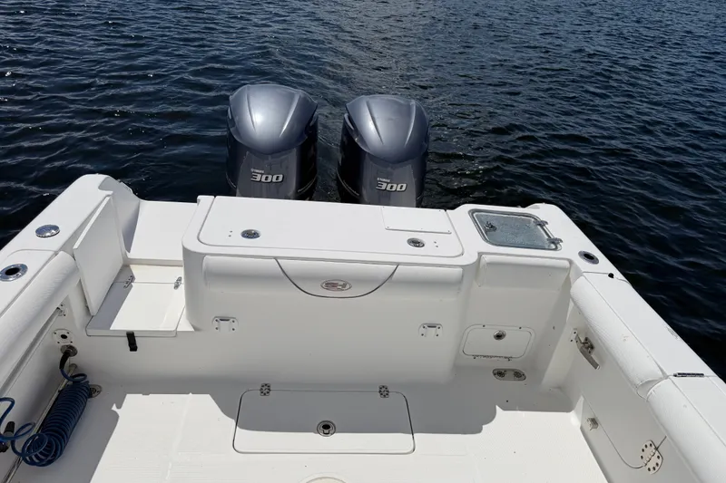 Slide: The Image of 2019 Sea Hunt Gamefish 30 boat with twin Yamaha 300 engines on open water. - 26