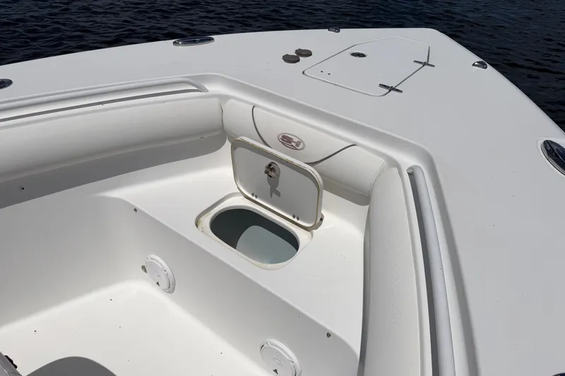 Slide: The Image of 2019 Sea Hunt Gamefish 30 boat deck with storage compartment open. - 24