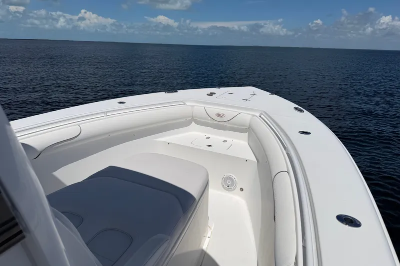 Slide: The Image of 2019 Sea Hunt Gamefish 30 boat on calm ocean waters under a clear sky. - 22