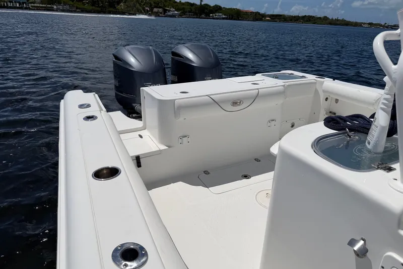 Slide: The Image of 2019 Sea Hunt Gamefish 30 boat with dual engines on calm water. - 27