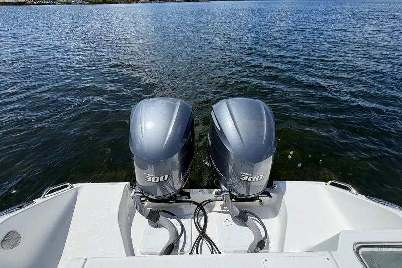 Slide: The Image of 2019 Sea Hunt Gamefish 30 with twin Yamaha 300 engines on water. - 32