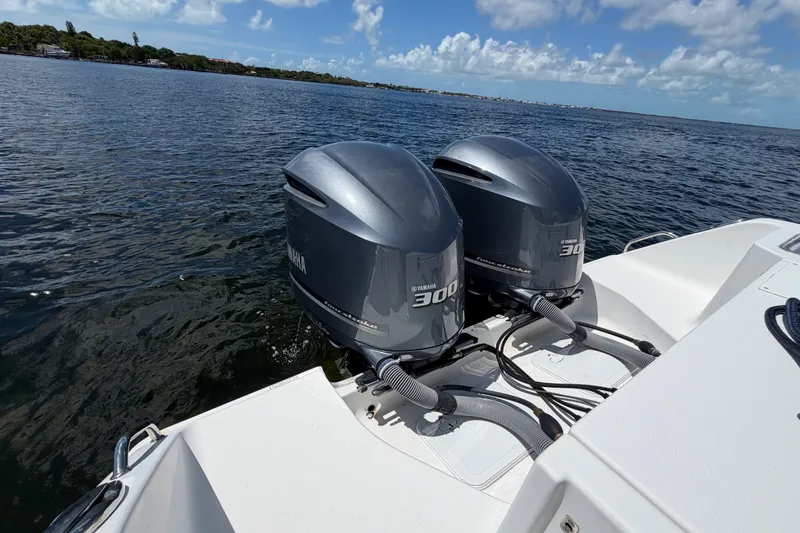 Slide: The Image of 2019 Sea Hunt Gamefish 30 with twin Yamaha 300 engines on open water. - 30