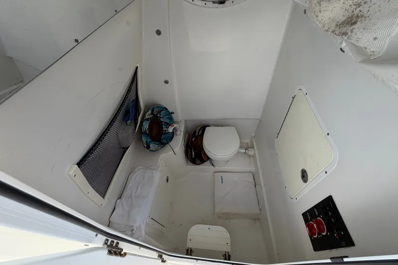 Slide: The Image of Interior of 2019 Sea Hunt Gamefish 30 boat with compact marine toilet. - 34
