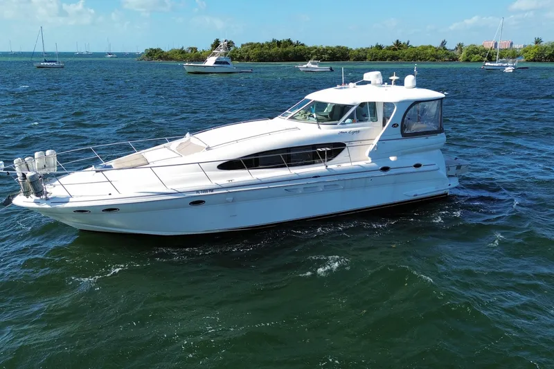 Slide: The Image of 2003 Sea Ray 480 Motor Yacht cruising on a sunny day in open waters. - 23