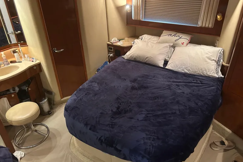 Slide: The Image of Luxurious bedroom interior of 2003 Sea Ray 480 Motor Yacht with cozy bedding. - 49