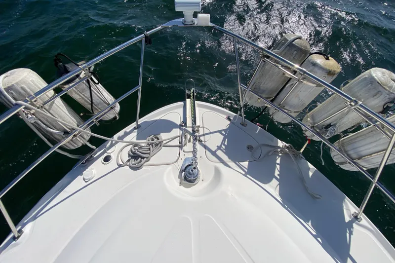 Slide: The Image of Top view of 2003 Sea Ray 480 Motor Yacht bow with fenders and anchor chain. - 27