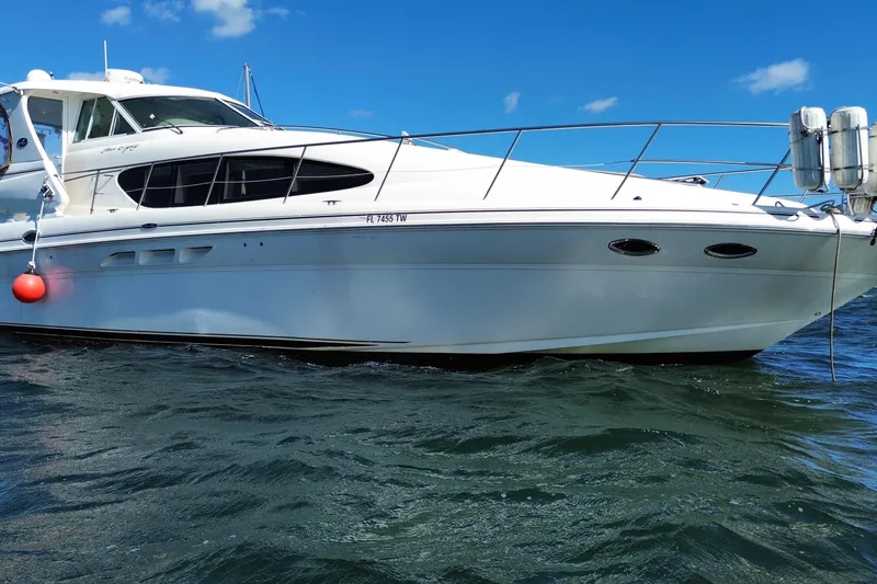 Slide: The Image of 2003 Sea Ray 480 Motor Yacht on water, sunny day, blue sky. - 19