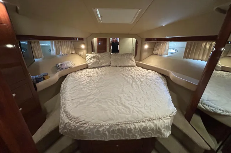 Slide: The Image of Luxurious bedroom interior of 2003 Sea Ray 480 Motor Yacht with elegant bedding. - 47