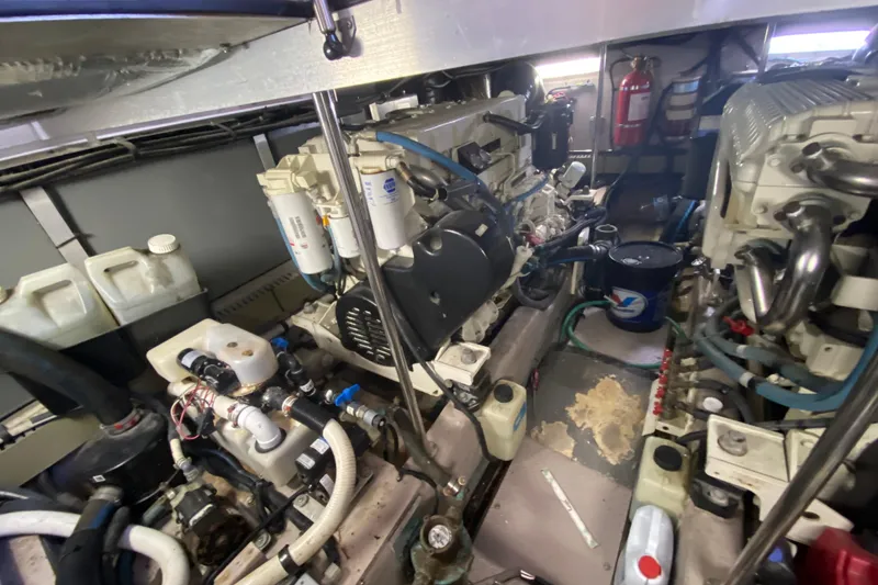 Slide: The Image of Engine room of a 2003 Sea Ray 480 Motor Yacht, showcasing mechanical components. - 53