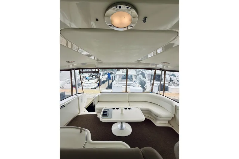 Slide: The Image of Interior of 2003 Sea Ray 480 Motor Yacht with spacious seating and table. - 33