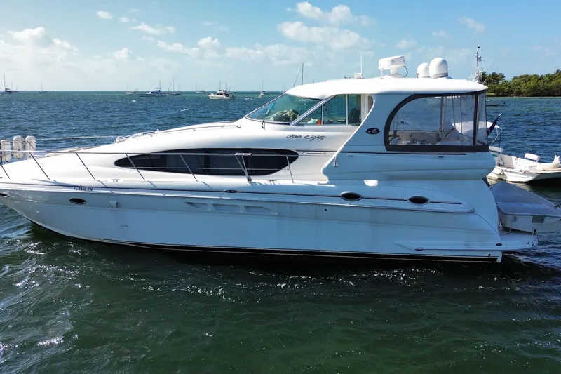 The Image of 2003 Sea Ray 480 Motor Yacht cruising on a sunny day with clear skies. - 0