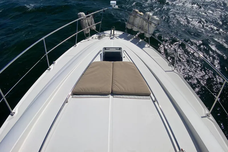 Slide: The Image of Top view of 2003 Sea Ray 480 Motor Yacht on water, showcasing deck and railings. - 26