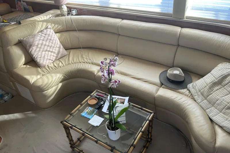 Slide: The Image of Luxurious interior of 2003 Sea Ray 480 Motor Yacht with leather seating and glass table. - 38