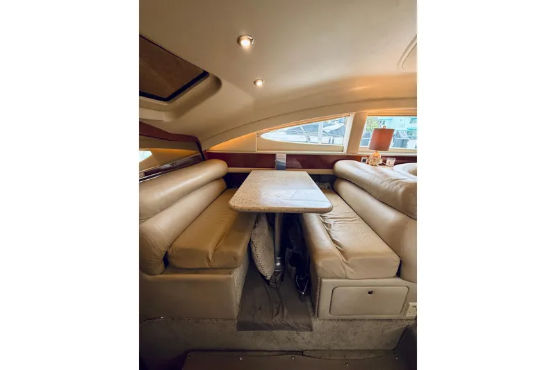 Slide: The Image of Luxurious interior of 2003 Sea Ray 480 Motor Yacht with plush seating and elegant table. - 43