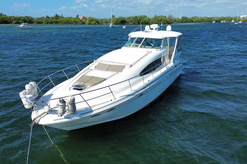 Slide: The Image of 2003 Sea Ray 480 Motor Yacht on open water, showcasing sleek design and luxury features. - 5