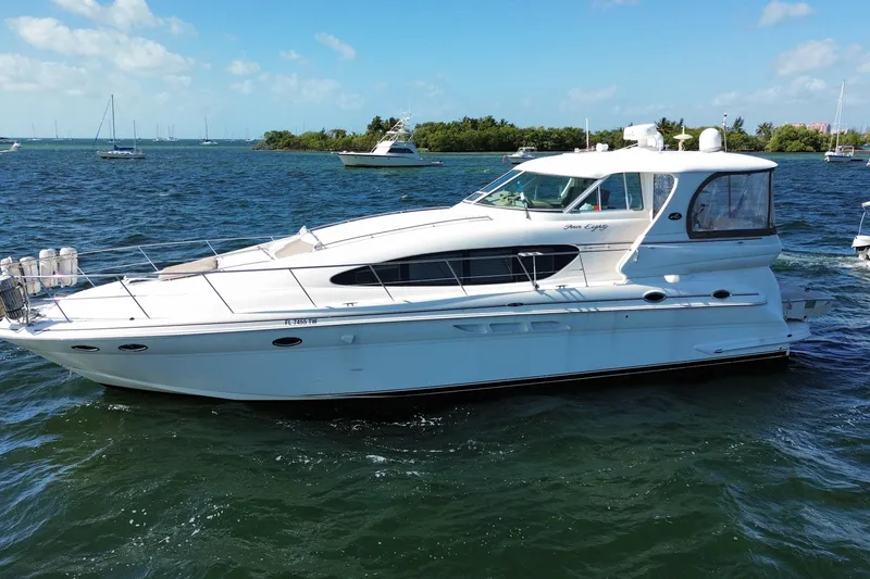 Slide: The Image of 2003 Sea Ray 480 Motor Yacht cruising on a sunny day with clear blue skies. - 4