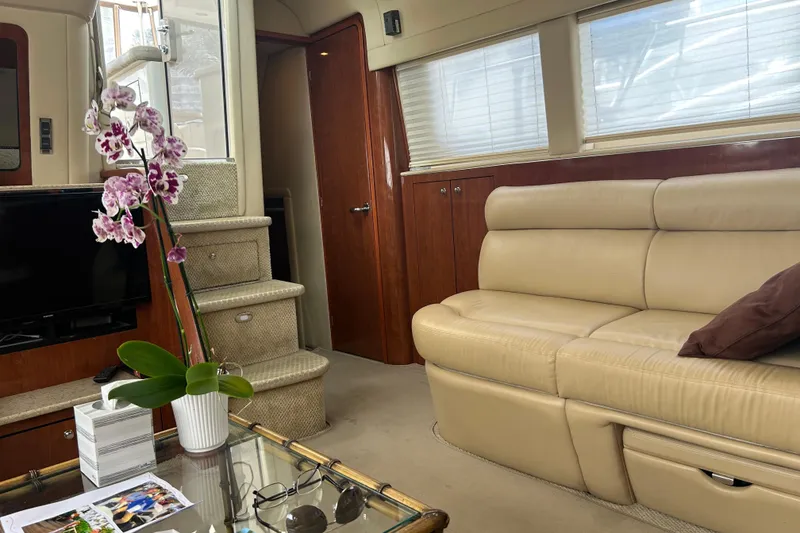 Slide: The Image of Luxurious interior of 2003 Sea Ray 480 Motor Yacht with beige leather seating and elegant decor. - 39
