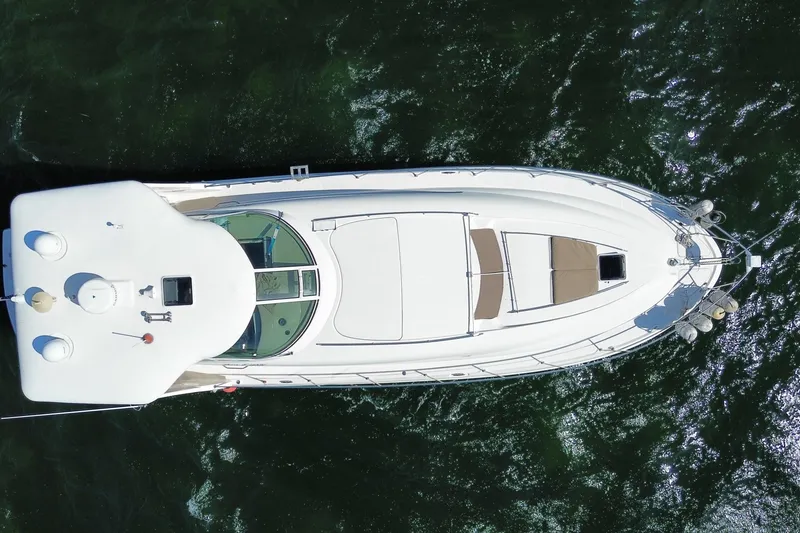 Slide: The Image of Overhead view of 2003 Sea Ray 480 Motor Yacht on water. - 60
