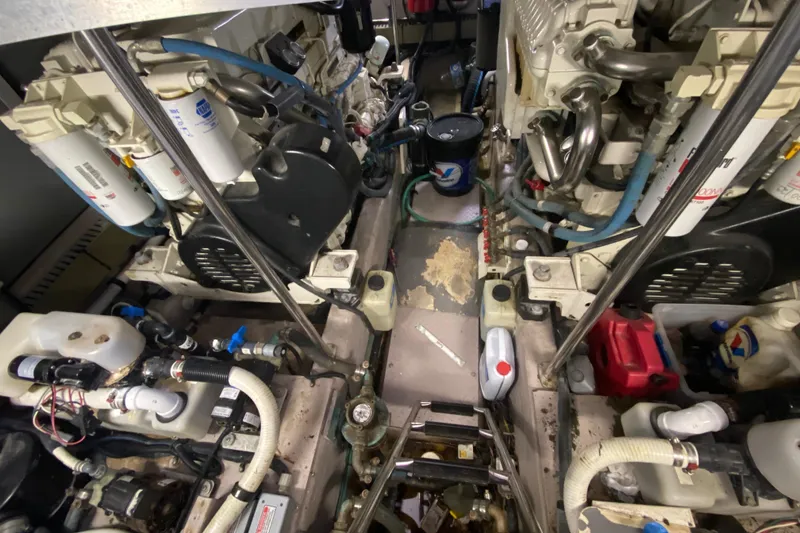 Slide: The Image of Engine room of a 2003 Sea Ray 480 Motor Yacht, showcasing complex machinery and components. - 55