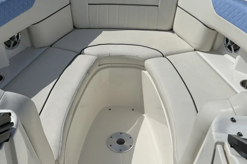 Slide: The Image of Interior seating of a 2006 Sea Ray 270 SLX boat, featuring white cushioned seats. - 3