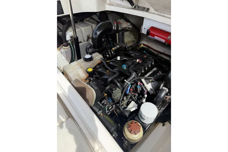 Slide: The Image of Engine compartment of a 2006 Sea Ray 270 SLX boat, showcasing detailed components. - 10