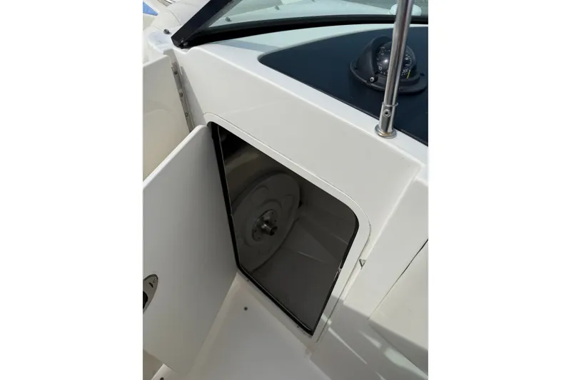 Slide: The Image of Open storage compartment on a 2006 Sea Ray 270 SLX boat, showcasing interior space. - 15