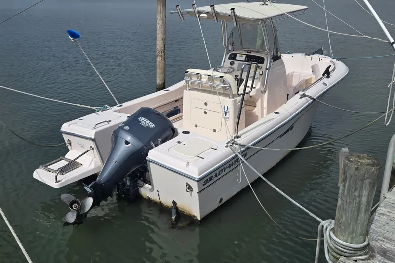 The Image of 2014 Grady-White Fisherman 230 boat docked on calm water. - 0