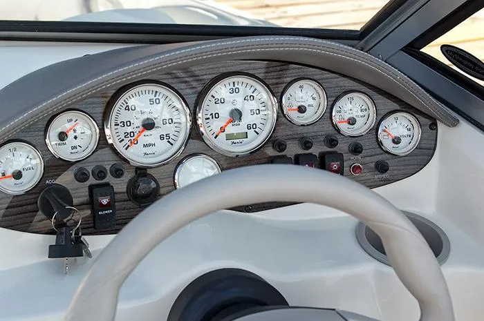 Slide: The Image of Manufacturer Provided Image: Dashboard of a 2013 Stingray 195 LS/LX boat with gauges and steering wheel. - 11