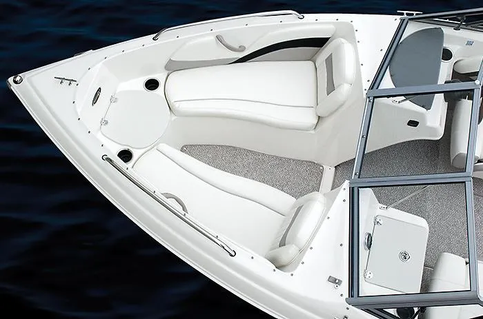 Slide: The Image of Manufacturer Provided Image: 2013 Stingray 195 LS/LX boat interior with white seating and open bow design. - 10