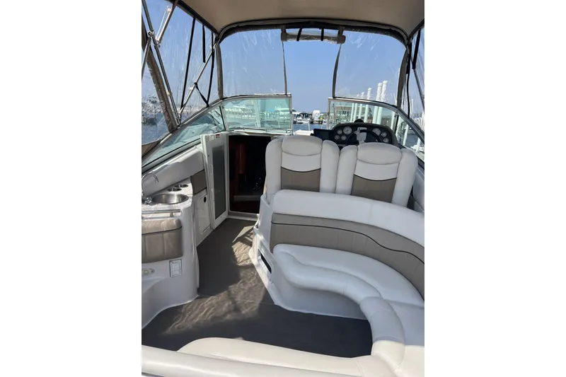 Slide: The Image of Interior of 2007 Four Winns 288 Vista boat with white seating and helm. - 15